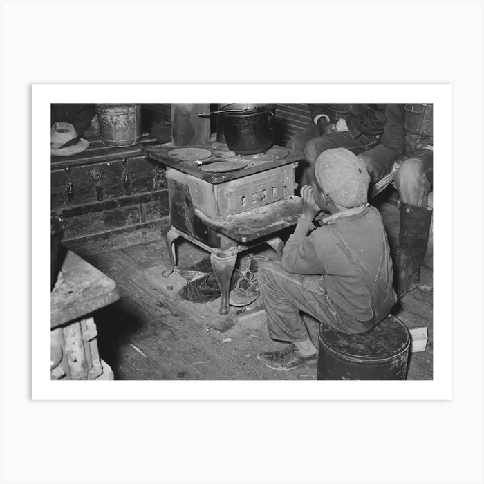 Boy Sitting By The Stove On A Cold Day In The Strawberry Picking Season, Near Independence, Louisiana By Russell Lee Art Print by Fy! Classic Art Prints and Posters